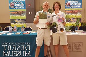 Two docents manning an event booth